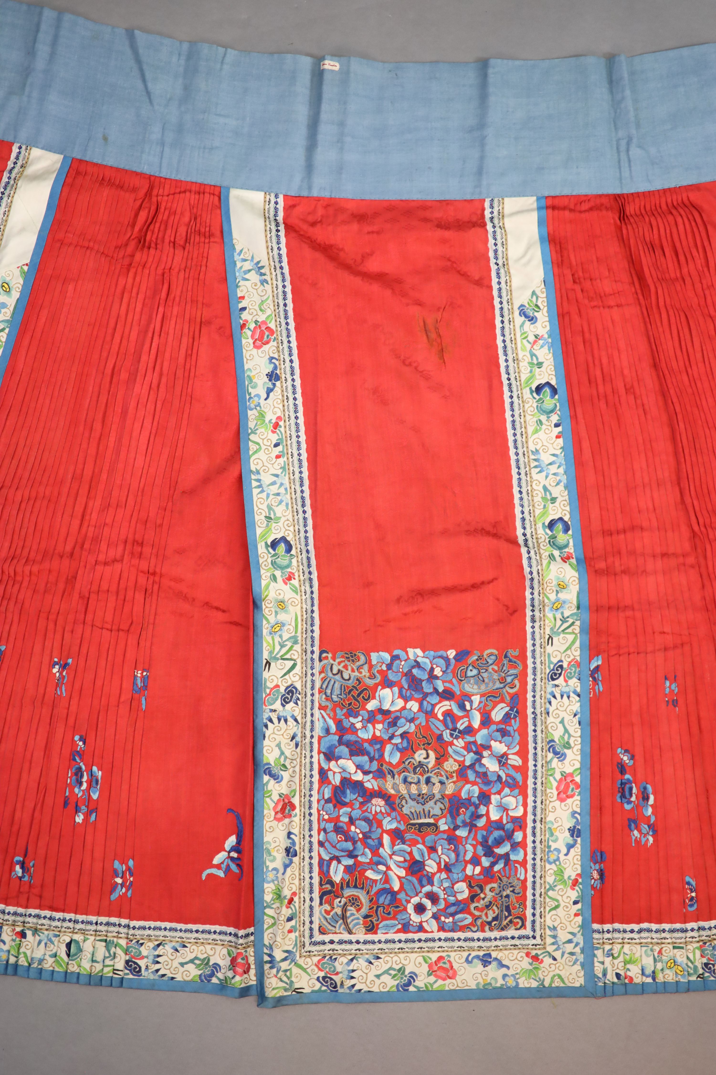 A 19th century Chinese red ground silk skirt